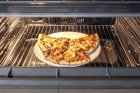 how to reheat pizza in oven