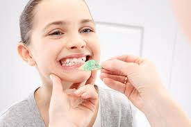 When does an orthodontist in Surrey recommend two-phase treatment?